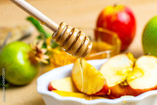 Rosh hashanah honey and apples symbolizing a sweet new year
