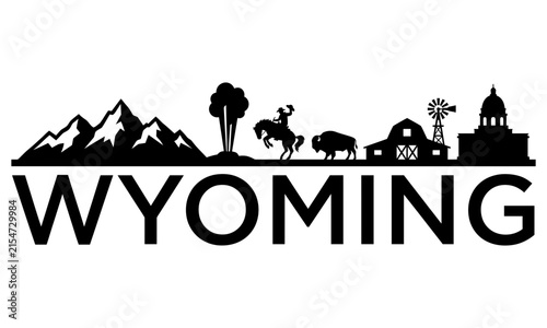 Black and white silhouette skyline illustration of wyoming featuring mountains a cowboy bison and state capitol building