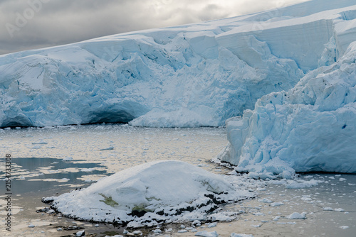 Antarctic expedition. Massive Antarctic Glacier Calving into the Ocean, Releasing Large Icebergs as the Ice Gradually Melts