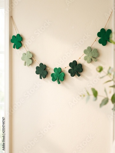 Shamrock garland hanging on a wall for St. Patrick’s Day decoration  