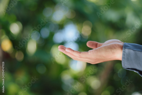 Obraz na plátně Hand held open palm up reaching out symbolizing value delivery customer care env
