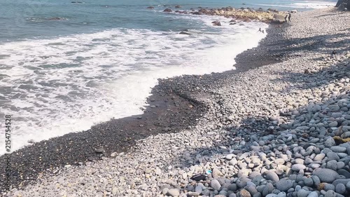 Waves washing over a pebble beach