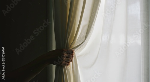 Person peeking through curtains.