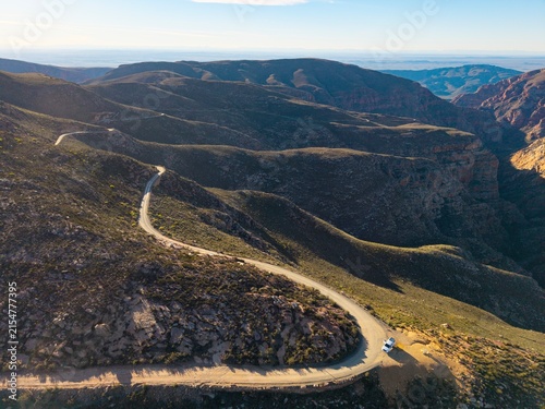 Aerial of winding dirt road mountain pass, Swartberg pass, South Africa