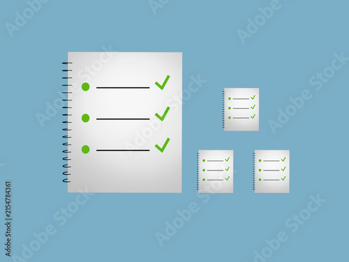 To do list and ticks on spiral notepads blue background