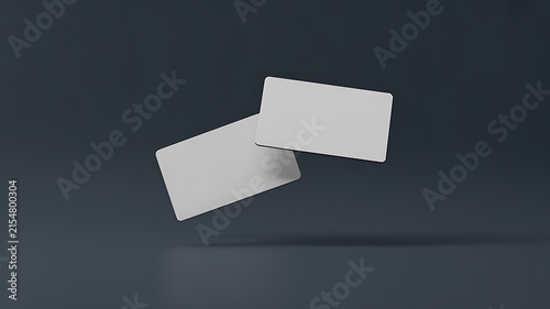 Business card mockups float against a dark grey backdrop.