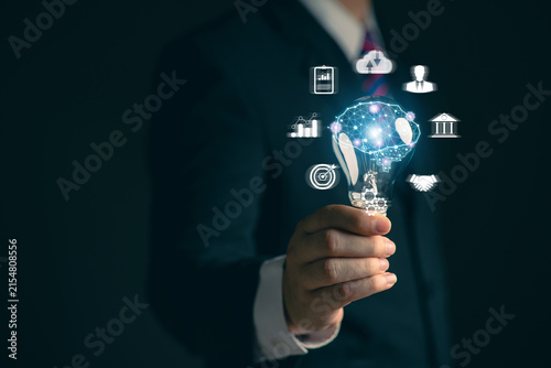 Businessman holding a light bulb. Network. Online business. Online business networking.. New ideas. Innovative ideas for online marketing...