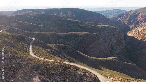 Aerial of winding dirt road mountain pass, Swartberg pass, South Africa