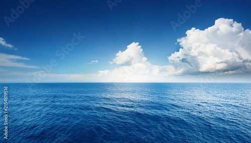 blue sea or ocean with sunny and cloudy sky