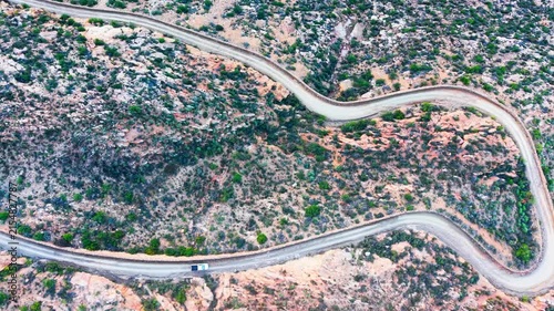 Aerial of winding dirt road mountain pass, Swartberg pass, South Africa