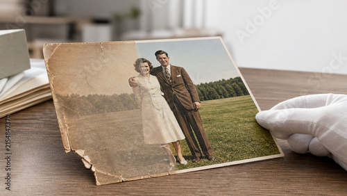 AI photo restoration transforming damaged image into clear color