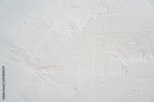White plaster wall texture. Weathered rough stucco surface with trowel marks background.