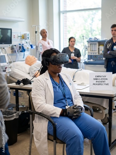 Nursing student wearing VR headset in empathy patient simulation