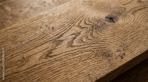 Close-up of weathered oak wood grain patterns and a knot, shallow depth of field.