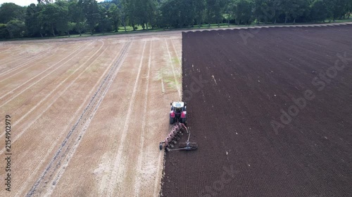 Aerial View of Tractor Plowing Agricultural Field