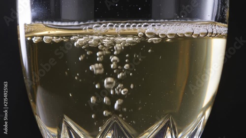 Bubbles of champagne rising in a glass
