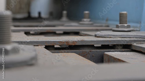 Close-up of shaking industrial machine plates