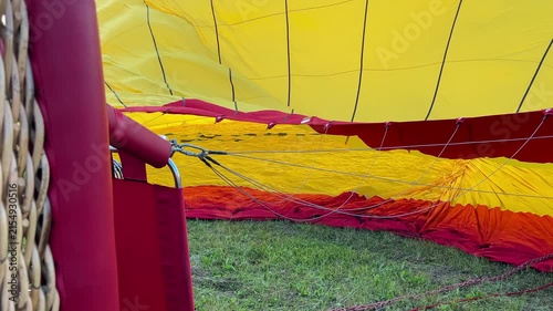Hot Air Balloon Inflating. Hot Air Balloon fire flame. Hot air from a gas burner fills the dome of the balloon.