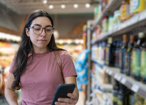 A person checking a shopping list