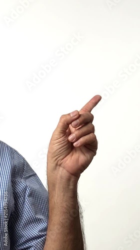 Indian Asian senior businessman with white beard confidently pointing with both hands to direct attention towards an important place or thing