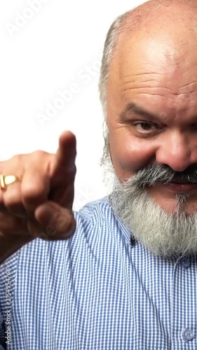 Indian Asian senior businessman with a white beard smiling and pointing both hands straight ahead