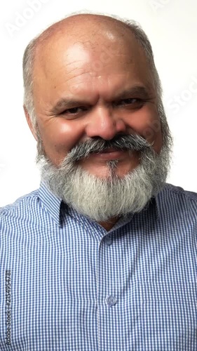 Indian Asian senior businessman with a white beard proudly showing victory gestures with both hands giving thumbs up, expressing success and joy 