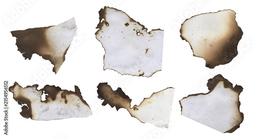 Collection of six burnt paper scraps with charred edges isolated on a transparent background for design and collage purposes transparent background