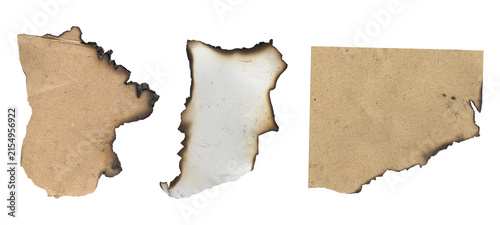Foto Collection of three burnt textured paper scraps with charred edges isolated on a