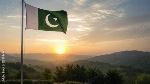 Pakistan Flag Waving at Golden Sunset Over Mountain Memorial