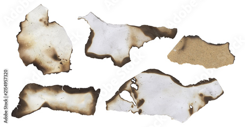 Five different shapes of burnt paper fragments with charred edges scattered and isolated on a transparent background for graphic design projects transparent background