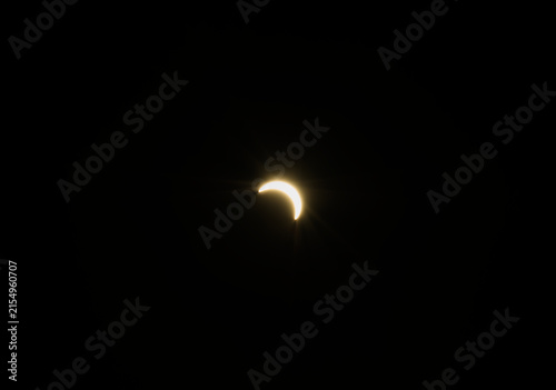 Canvas Print Partial solar eclipse in the evening sky over Norfolk UK