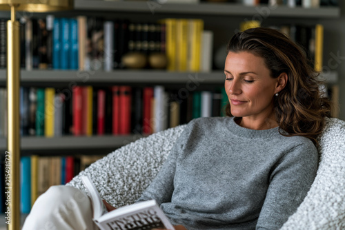 An exquisite and picturesque depiction of young adult reading in a stylish living room with floating wall bookshelves, contemporary interior design, natural lighting, premium home furnishing visual