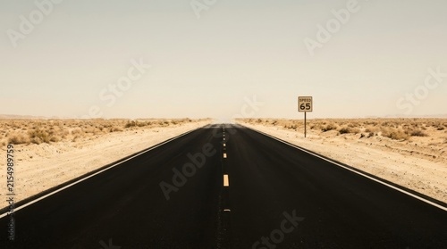 Endless Asphalt Desert Highway Stretching Into The Horizon