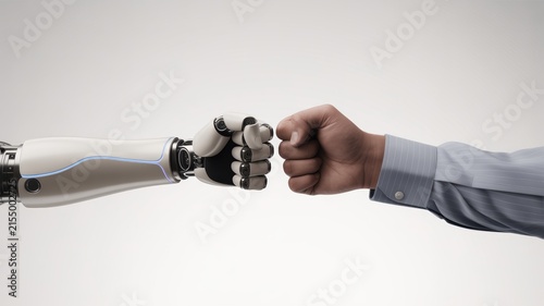 Robotic arm and human hand fist bumping representing future cooperation technology partnership success on a clean isolated white studio background