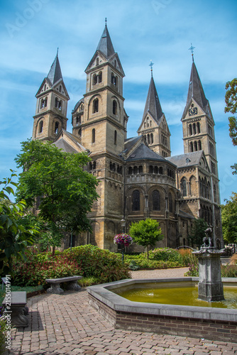 Historic Munster Church in Roermond, Netherlands, with garden and fountain