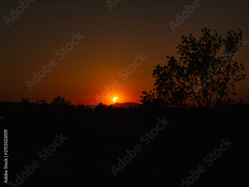 Partial solar eclipse in 2026 at the city of Zagreb, Croatia when moon covered part of the sun at sunset