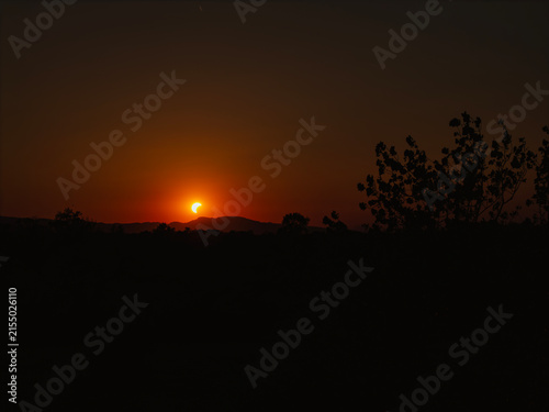 Partial solar eclipse in 2026 at the city of Zagreb, Croatia when moon covered part of the sun at sunset