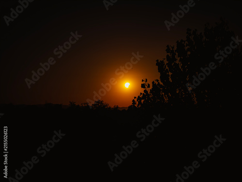 Partial solar eclipse in 2026 at the city of Zagreb, Croatia when moon covered part of the sun at sunset