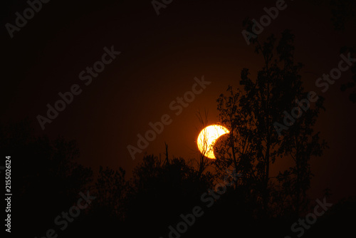 Partial solar eclipse in 2026 at the city of Zagreb, Croatia when moon covered part of the sun at sunset