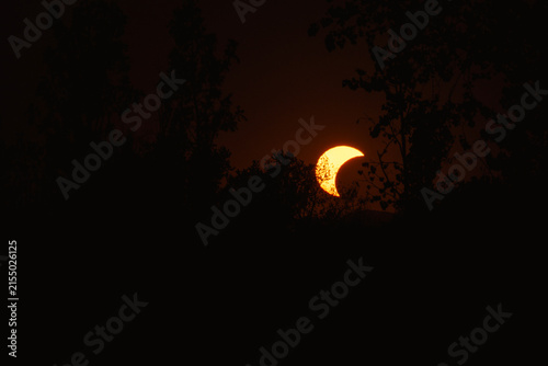 Partial solar eclipse in 2026 at the city of Zagreb, Croatia when moon covered part of the sun at sunset