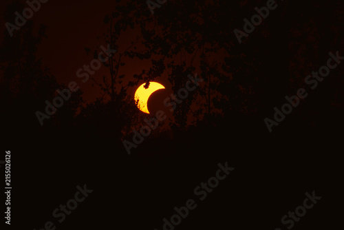 Partial solar eclipse in 2026 at the city of Zagreb, Croatia when moon covered part of the sun at sunset