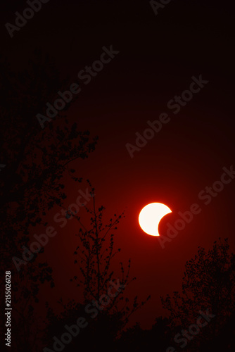 Partial solar eclipse in 2026 at the city of Zagreb, Croatia when moon covered part of the sun at sunset