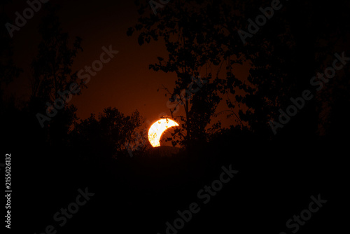 Partial solar eclipse in 2026 at the city of Zagreb, Croatia when moon covered part of the sun at sunset