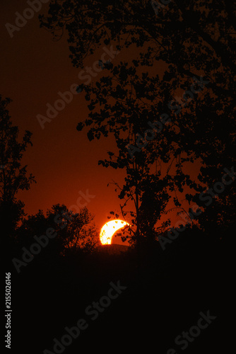 Partial solar eclipse in 2026 at the city of Zagreb, Croatia when moon covered part of the sun at sunset
