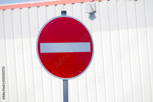 Road sign prohibiting entry, showing restriction and warning