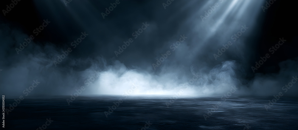 Obraz premium A stark, dark room with smoke, rays, and a glow on the walls creates the ideal setting for a copy space image.