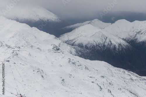 Aerial view of snowy mountain peaks in New Zealand.