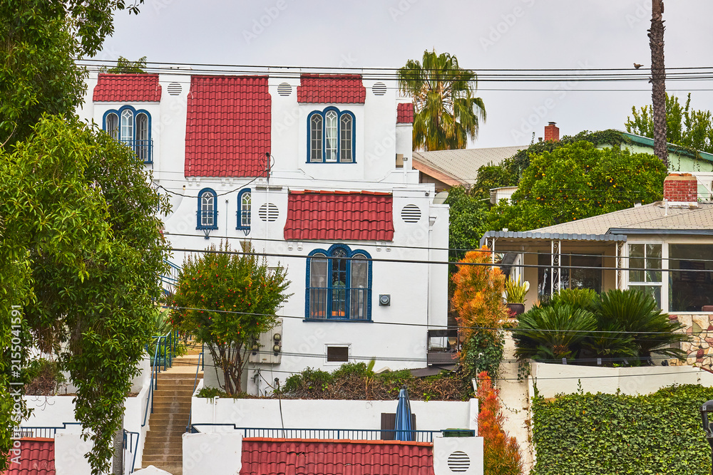 Fototapeta premium Spanish Style House Red Tile Roof and Lush Greenery in Echo Park Los Angeles