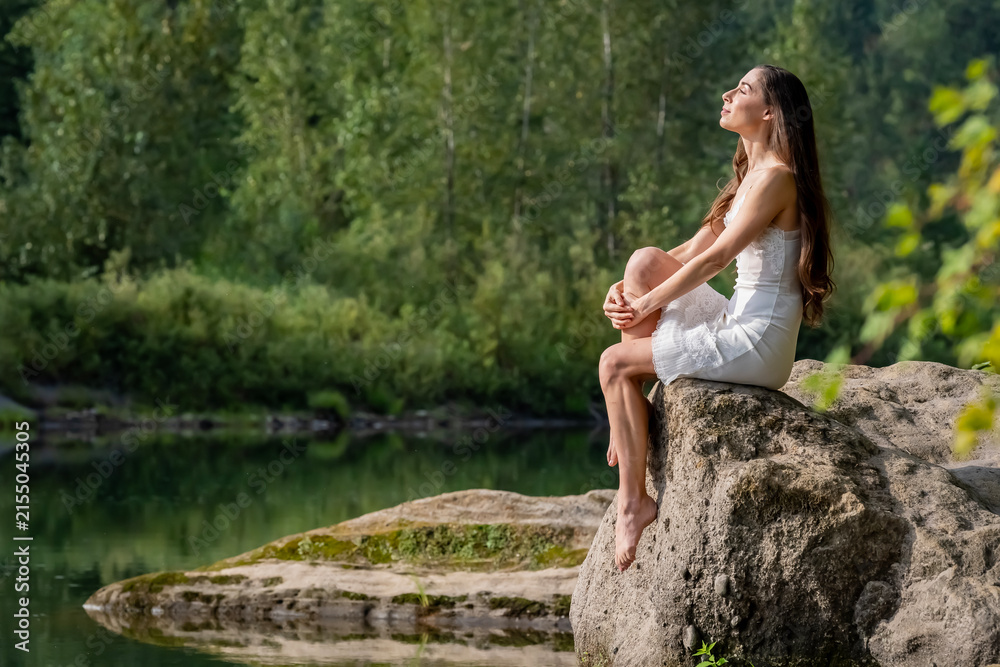 Fototapeta premium A Lovely Model Poses Outdoor While Enjoying The Summer Weather