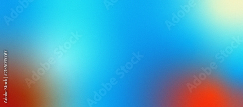 Abstract gradient background with vibrant blue and warm orange tones and grainy texture